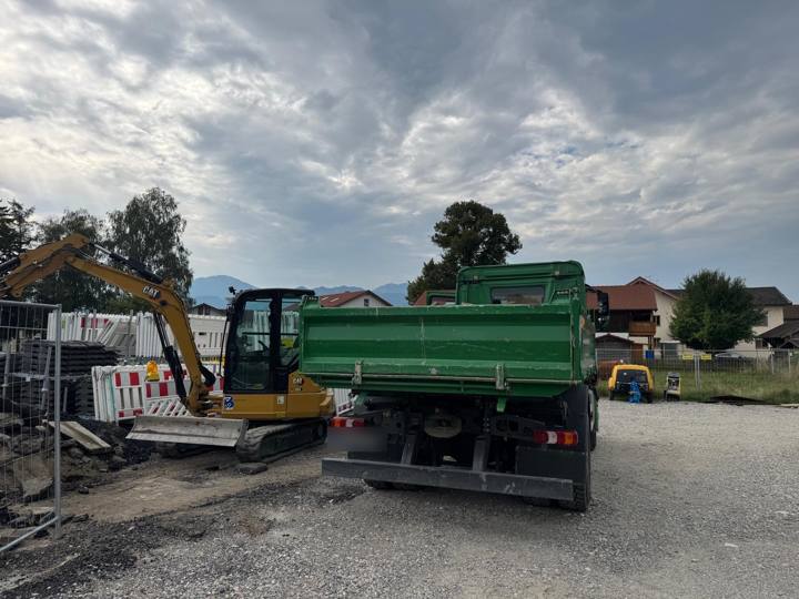 Excavator and tipper on site